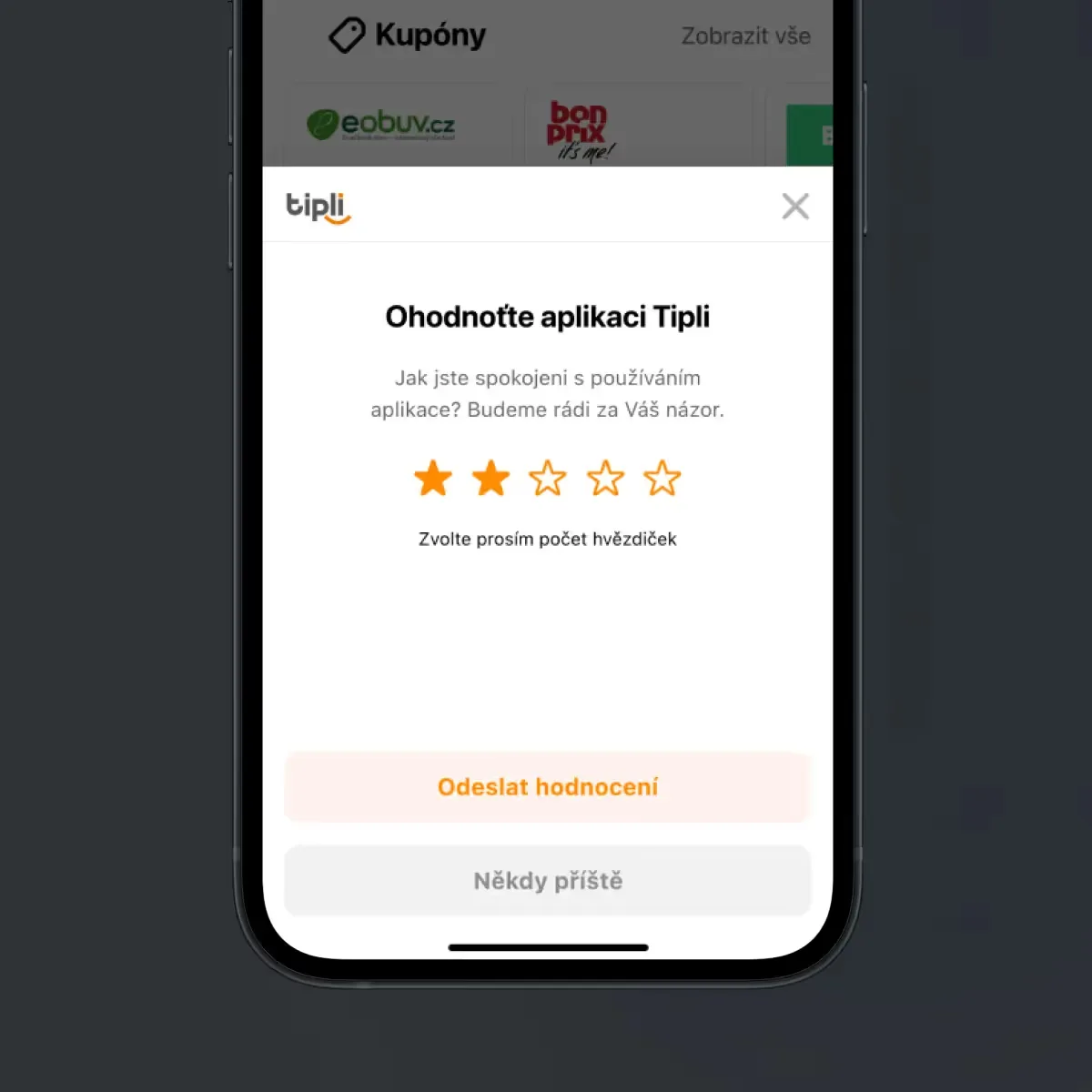 A phone on a dark ground with the in-app prompt Ohodnoťte aplikaci Tipli — a five-star rating, Odeslat hodnocení and Někdy příště buttons